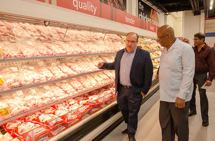 Minister of Finance, Winston Jordan (right) and Chairman of Massy’s Integrated Retail Business Unit, David Affonso touring the new Mega complex (Delano Williams photo