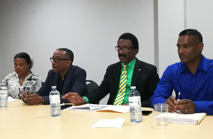 Attorney-General Basil Williams and organisers of the meeting at the head table