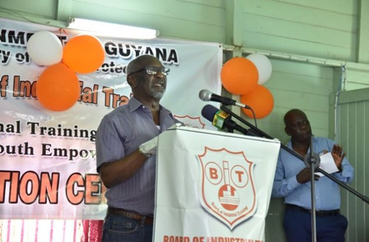 Minister within the Ministry of Social Protection, Keith Scott, addressing Baracara residents and the graduates of a recent boat-building training programme facilitated by the Board of Industrial Training (BIT)