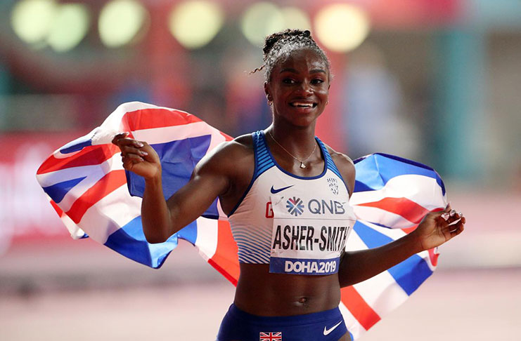 Britain's Dina Asher-Smith celebrates winning gold. (REUTERS/Ahmed Jadallah)