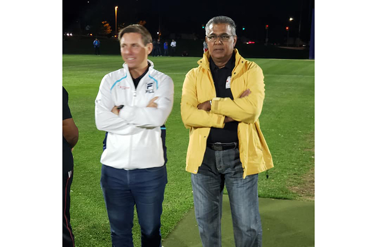 Mayor Patrick Brown (left) and BEDCL president Praimp Persaud during an exhibition match to mark the introduction of lights at Teramoto Park
