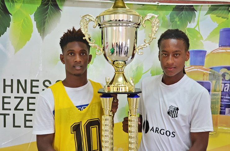Nicholas McArthur (left) of Fruta Conquerors U-20 shares the trophy with his opponent Marcus Wilson of Santos U-20.