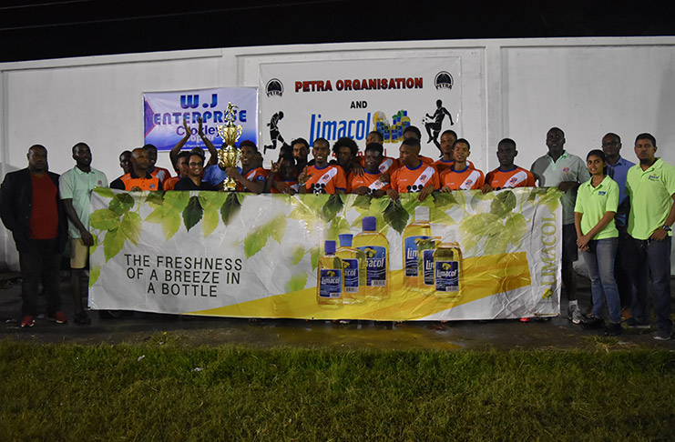Fruta Conquerors celebrate with the Limacol after their 2-0 victory over  Santos FC on Sunday night.