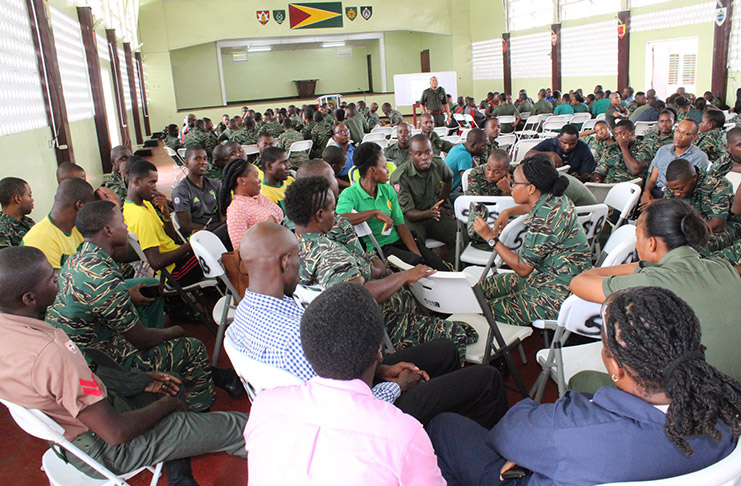 Soldiers discussing aspects of the Domestic Violence Act