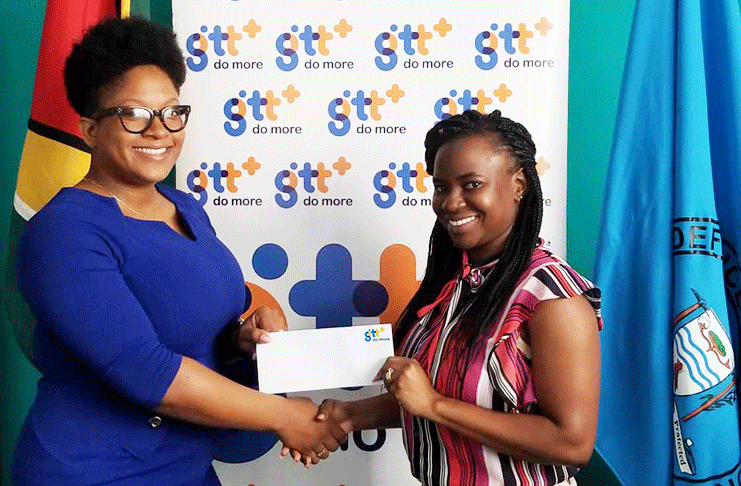 GTT’s Public Relations and Corporate Communication Manager, Jasmin Harris handing over the cheque to CDC’s Project Manager (ag), Anita Layne