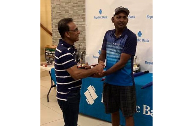 Rakesh Harry collects his first place trophy.