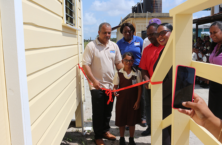 FFTP CEO Kent Vincent along with Shaundell Hercules from the Department of Education opening one of the kitchenettes at Riverstown Primary.
