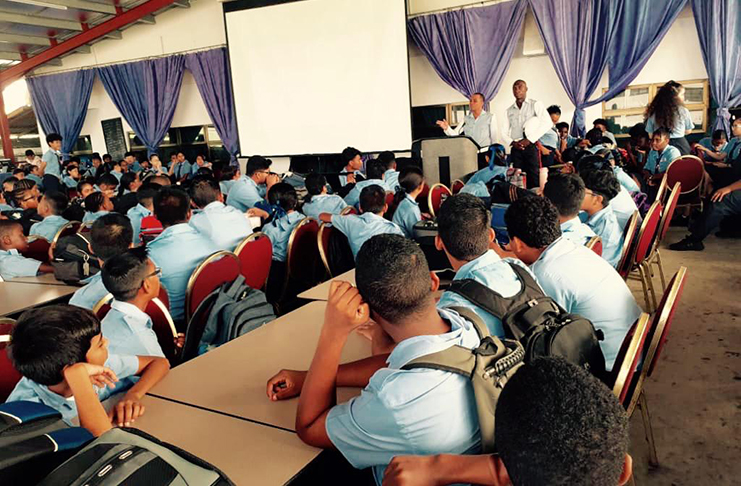 Students listen to the police during the lecture