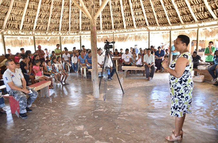 Minister of Public Health, Volda Lawrence engages Monkey Mountain residents.