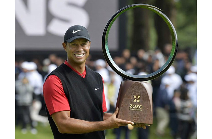 Tiger Woods holds a winning trophy as he celebrates to win the Zozo Championship, a PGA Tour event, at Narashino Country Club in Inzai, Chiba Prefecture, east of Tokyo, Japan on  Sunday Mandatory credit Kyodo/via REUTERS