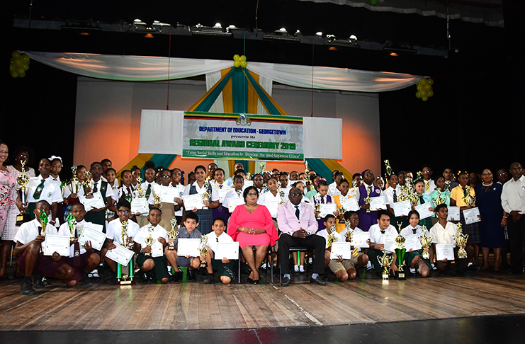 The awardees displaying their prizes (Adrian Narine photo)