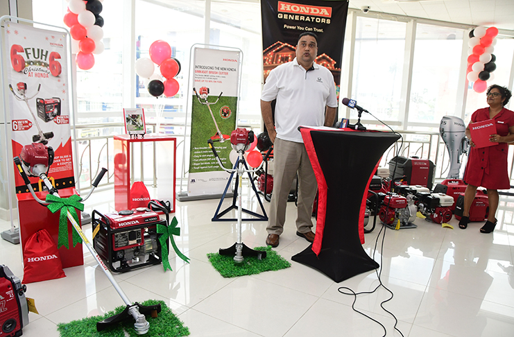 General Manager of Marics & Co.LTD., Anand Kalladeen, with the new Honda UMk450T brush cutter. – Adrian Narine Photo