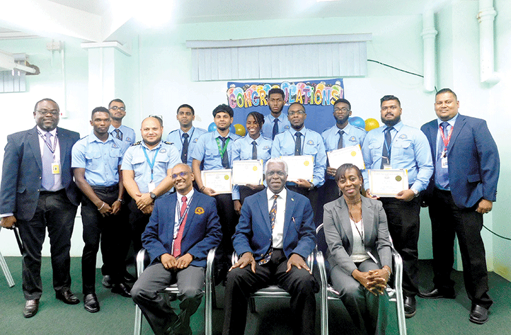 Director-General, Lt. Col. (Ret’d) Egbert Field flanked by ANS Director,  Rickford Samaroo, and Human Resources Manager, Carol Primus, along with the instructors and graduates of the Approach Control (non-radar) App0119 programme