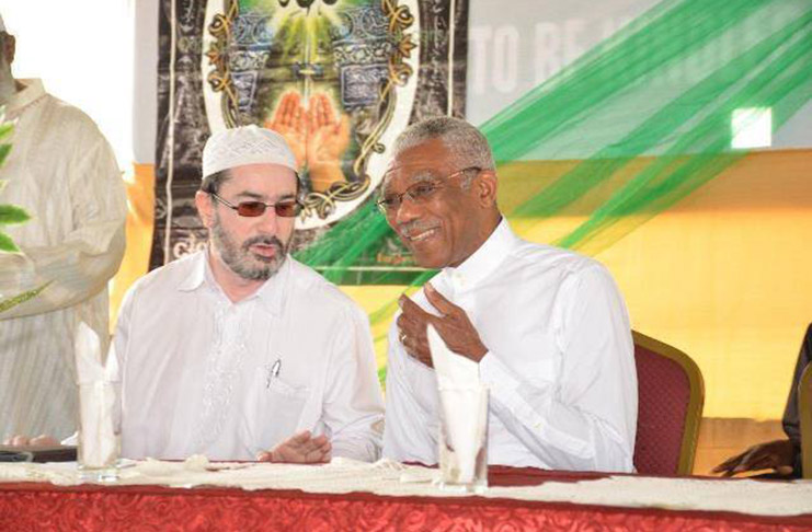 President David Granger and Shaykh Moeenul Hack, Head of the Central Islamic Organisation of Guyana (CIOG) sharing a light moment during the 2015 Youman Nabi programme. (Photo courtesy of Department of Public Information)