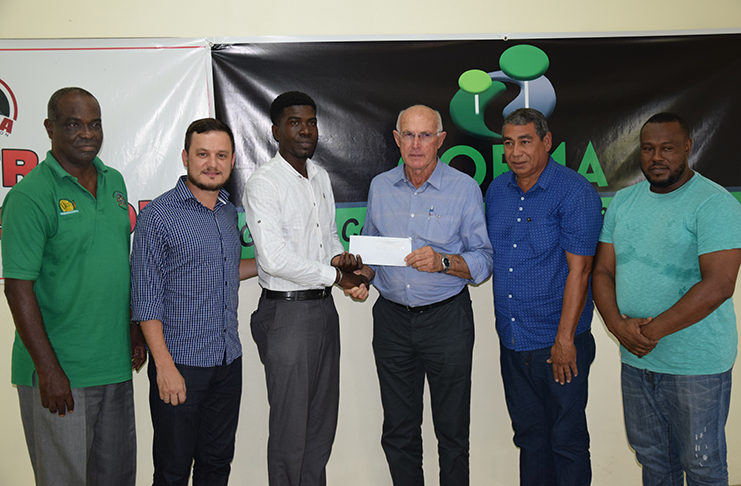 From L-R tournament Logistics Officer, Lawerence Griffith and COEMA Administrative Manager, Marco Saluador, watch on as PETRA’s Mark Alleyne collects the sponsorship cheque from CEOMA Founder/Owner Aurelio Sella. Also in the photo are CEOMA Guyana operations manager, Dereck Melville Jekir and PETRA’S Troy Mendonca