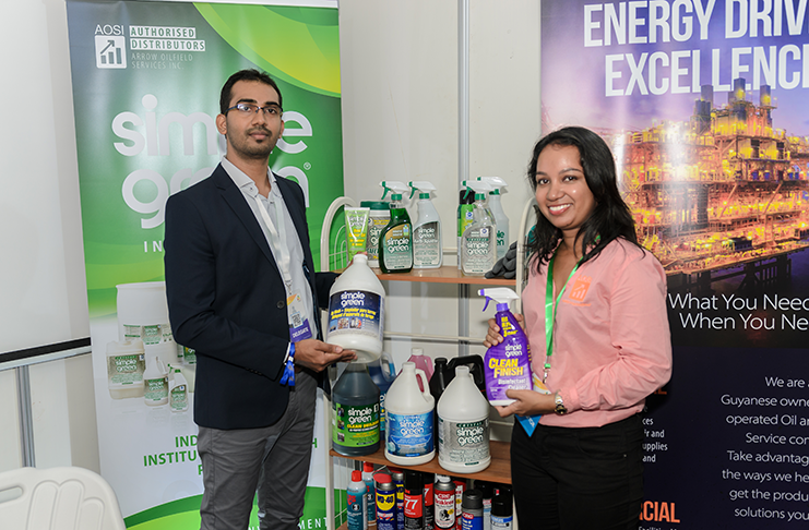 Arrow Oilfield Services Incorporated (AOSI) Director of Arrow Oilfield, Kabir Mahadeo and Coordinator and Procurement Manager, Deepa Sukha display some of their cleaning products (Delano Williams photo)