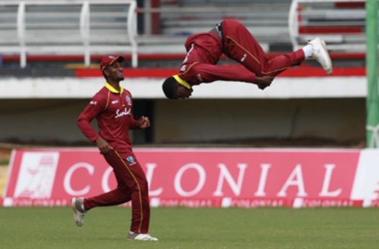 Kevin Sinclair of the WI Emerging Players does a back flip as he celebrates a wicket against Barbados Pride on Thursday. (Photo courtesy CWI Media)