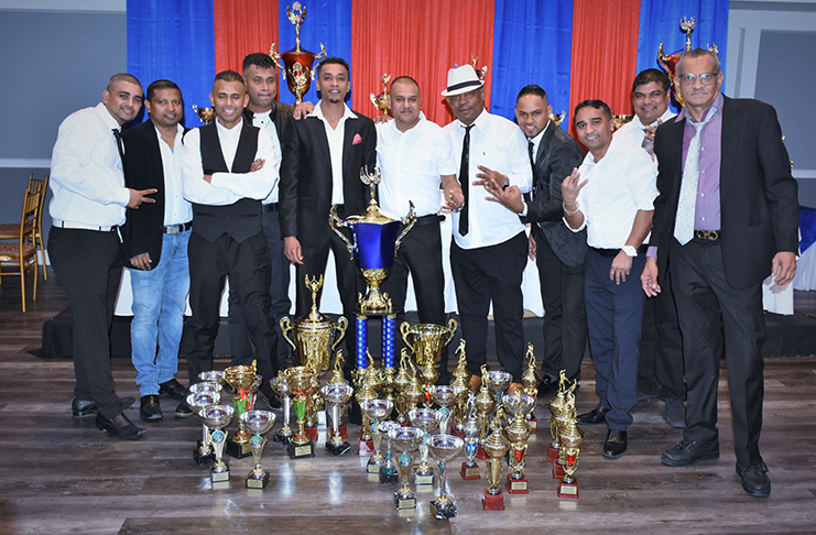 Members of Mercenary pose with their winnings. At extreme right is 15-over sponsor Dharam Paul Singh.