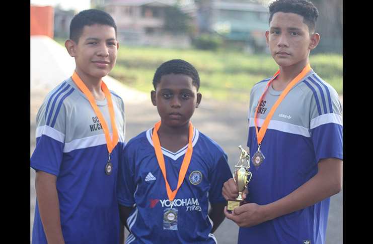 The GCC U-13 goal scorers in the final: (l-r) 13-year-old Joshua Bento, 10-year-old Shane Sargeant and winner of the Most Goals trophy, 13-year-old Vladimir Woodroffe.
