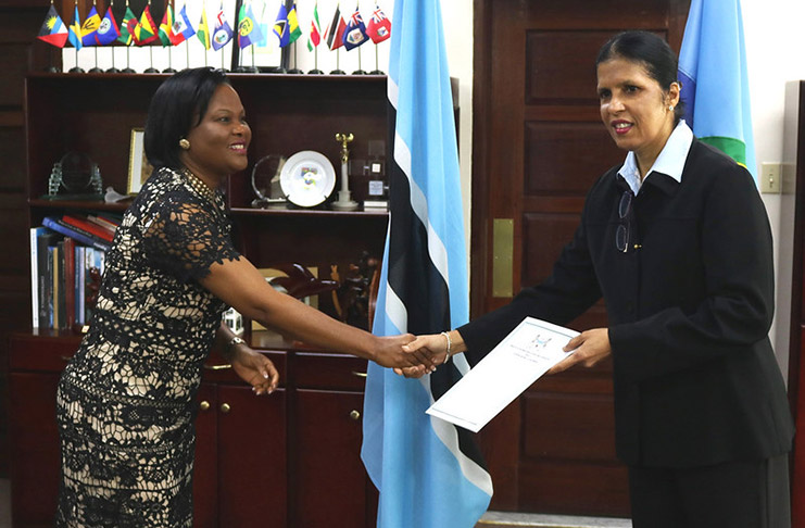 CARICOM's Deputy Secretary-General Ambassador Manorma Soeknandan (right) receives Letter of Credence from Botswana's new Ambassador to CARICOM HE Tebogo Motshome
