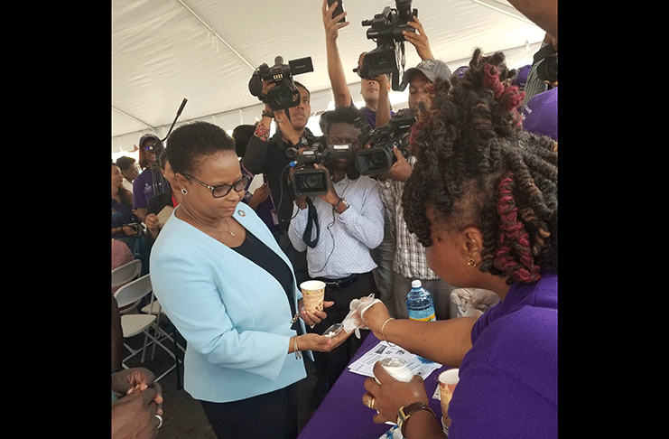 Minister of Public Health, Volda Lawrence, accepting her IDA tablets at the launch of the 2019 ‘Lymphatic Filariasis Elimination’ Campaign