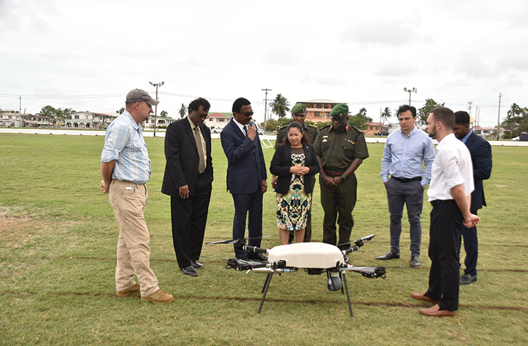 Minister of State, Mrs. Dawn Hastings- Williams, Minister of Public Security, Mr. Khemraj Ramjattan and Attorney General, Mr. Basil Williams inspecting the drone in the presence of Chief of Staff of the Guyana Defence Force, Brigadier Patrick West, Chief Executive Officer of the Skyfront company, Mr. Tory Mestler and other officials.
