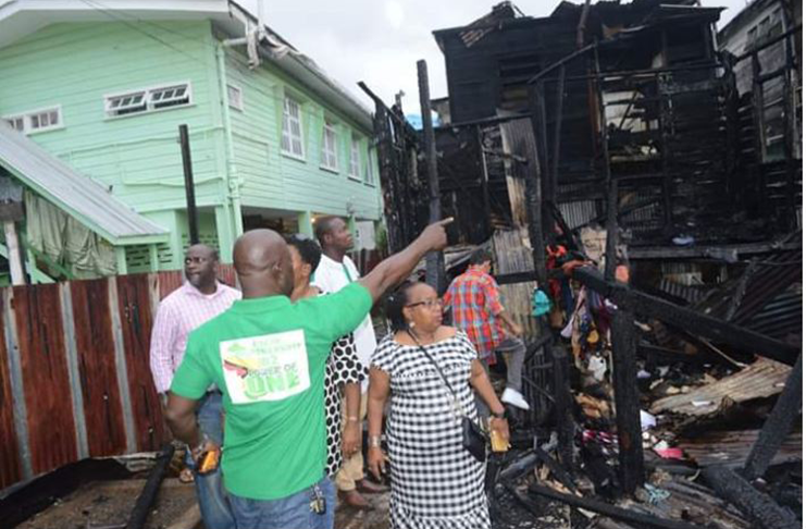 Minister Ferguson gets a first-hand look at the destruction made by the fire