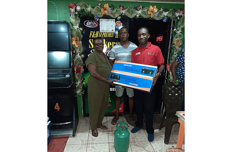 In photo, M. Heekima Paul of Massy Gas Products presents the overall winner and Most Valuable Player, Cheryl Fraser, with a complete Gas Range for her outstanding performance.