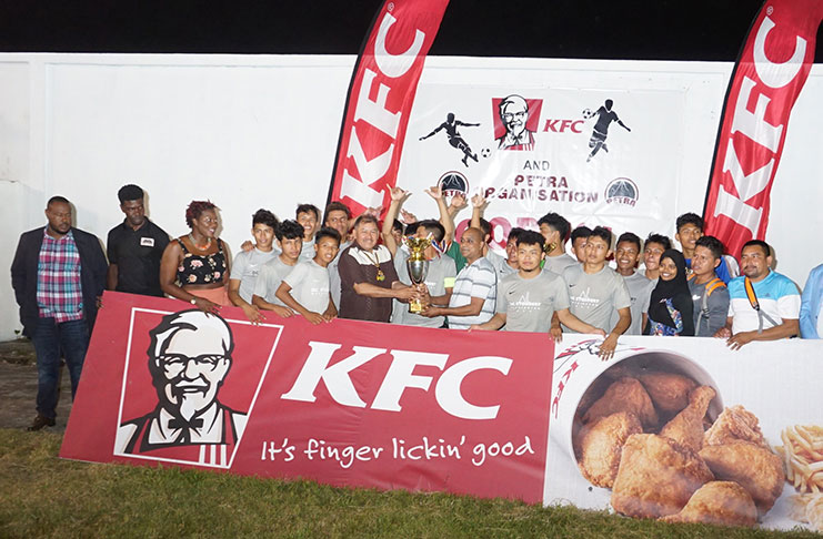 Annai Secondary players display their trophy for winning the KFC Goodwill series. (Elvin Croker photos)