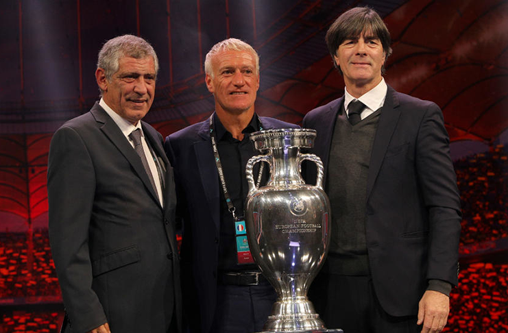 Germany coach Joachim Loew, Portugal coach Fernando Santos and France coach Didier Deschamps pose with the trophy after being drawn in Group F of Euro 2020 Finals Draw. (REUTERS/Stoyan Nenov)