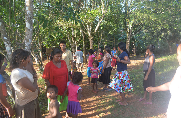 A number of migrants interacting with each other