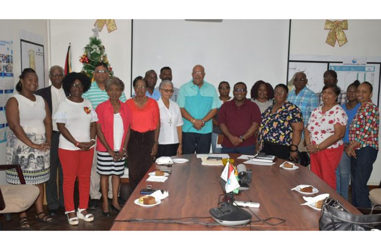 Managing Director of GWI, Dr. Richard Van-West Charles and Executive Director of Commercial Services & Customer Relations, Marlon Daniels, with representatives of indigent homes and orphanages
