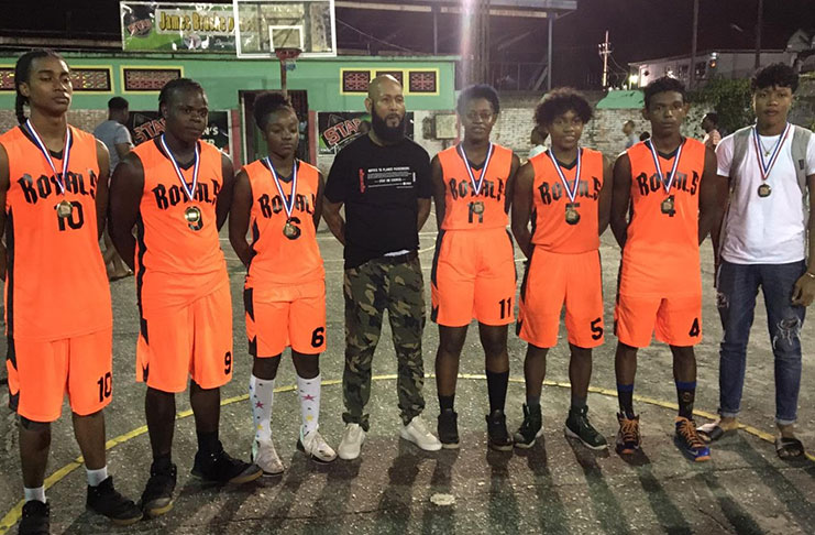 Gary Stephens, fourth from left, with the winning Victory Valley Royals team after they received their medals.