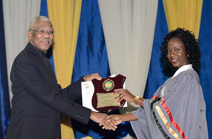 President David Granger presents the President’s Award to the Overall Best Graduating Student, Ateisha Brandt, at the CPCE 2019 graduation ceremony (Delano Williams photo)