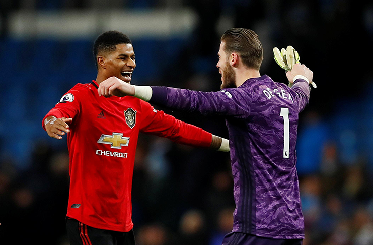 Manchester United's Marcus Rashford and David De Gea celebrate after the match yesterday v Manchester City.   (Action Images via Reuters/Jason Cairnduff)