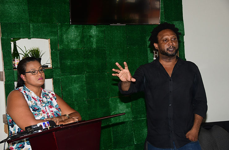 Executive member of TCI, Ruel Johnson makes a point as presidential candidate Rondha-Ann Lam looks on (Adrian Narine photo)