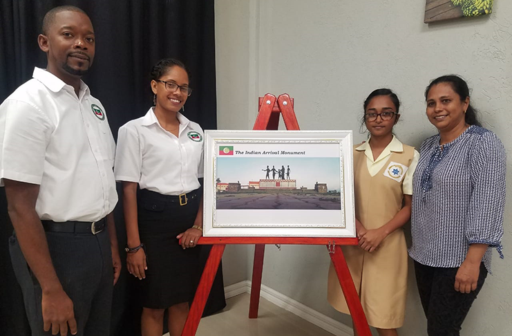 Co-chairs of the Upper Berbice, Corentyne Regional Tourism Group, Travis Issaacs (left) and Keisha Hamid (second from left), with Priya Malaram (second from right) and her mother, winner of the regions Tourism Awareness Month Secondary School photography competition (Tamica Garnett photo)