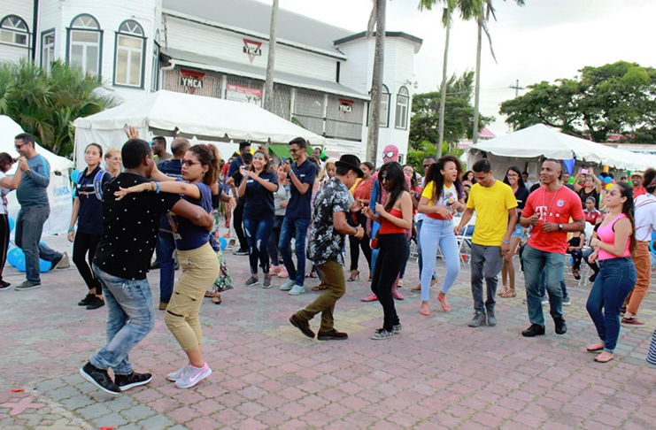 A mixed crowd of patrons learn a Latino dance as part of the Guyana/Venezuela Day celebrations (Vishani Ragobeer photos)