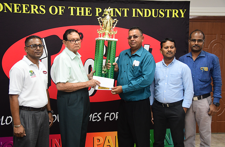 Kennard’s Memorial Turf Club president Cecil Kennard (left) receives the sponsorship cheque from Continental Group of Companies Office Manager, Ravi Brijnandan, (right) in the presence of the company’s representatives (Adrian Narine photo)