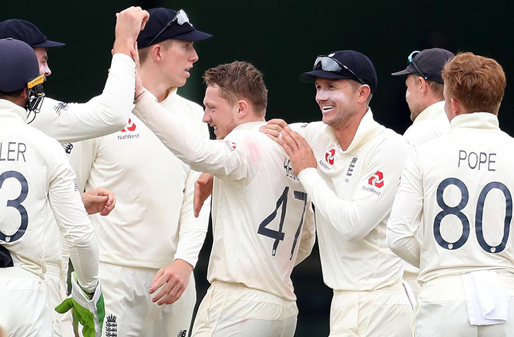 England's Dom Bess celebrates with teammates after taking the wicket of South Africa's Rassie van der Dussen at St George's Park, Port Elizabeth, South Africa. (REUTERS/Siphiwe Sibeko)