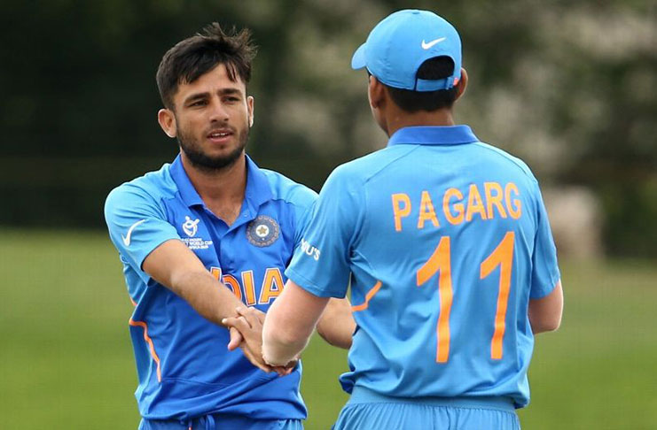 Ravi Bishnoi and Priyam Garg celebrate a wicket. (ICC via Getty Images)