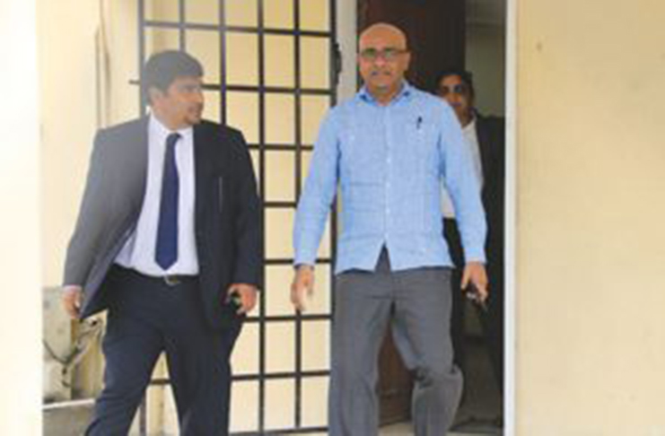 Opposition Leader, Bharrat Jagdeo and Attorney Sanjeev Datadin leave the Criminal Investigation Department (CID) in March 2017 in relation to the Pradoville 2 land scam. (Inews photo)