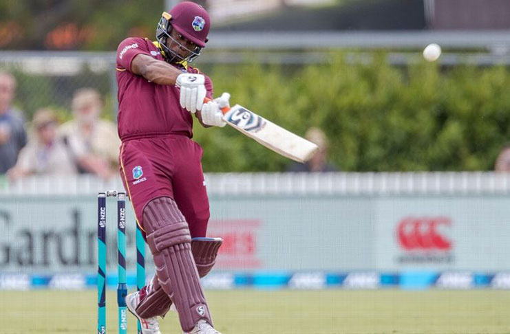 Evin Lewis slices the ball over mid-off. (Getty Images)