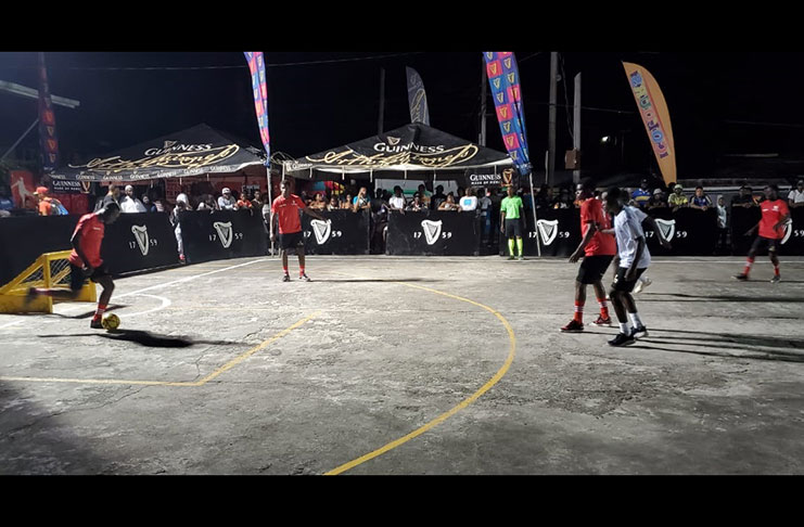 Action between Elite Ballers (white) and Presidential at the Silver City hard-court in the Guinness ‘Greatest of the Streets’ Linden Championship