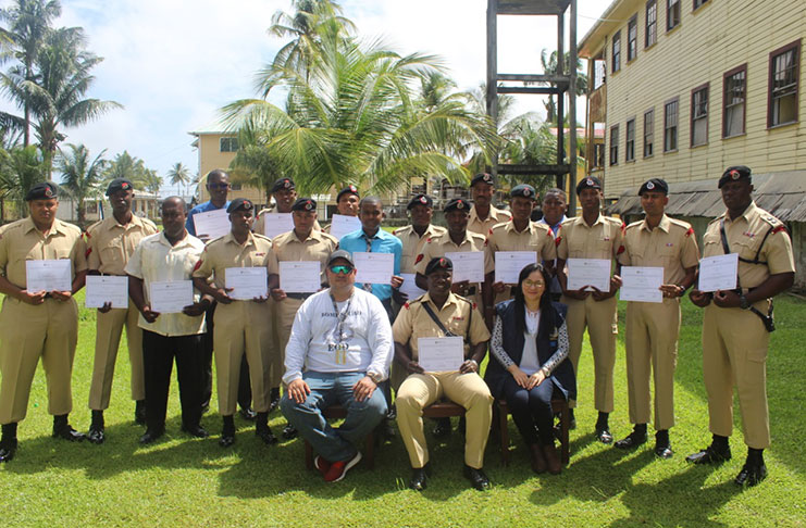 Alin Wilson (seated from left) and Johanna Garcia (seated at extreme right) with ranks who participated in the marking machine training