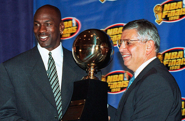 In this June 18, 1996, file photo, Chicago Bulls' Michael Jordan, left, receives NBA Finals Most Valuable Player trophy from Commissioner David Stern during a ceremony in Chicago.