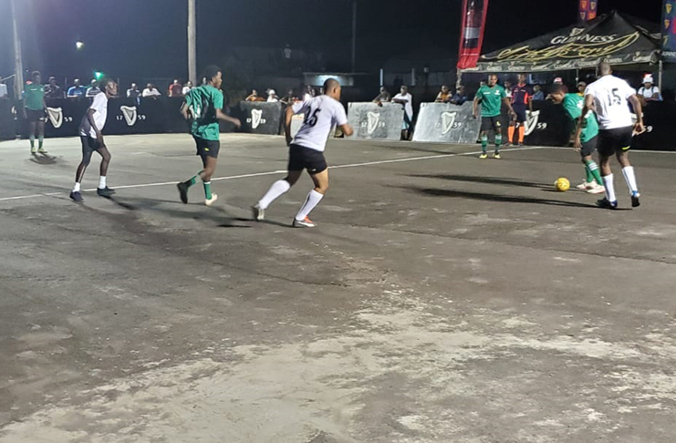 Action between Silver Bullets (white) and defending champion, High Rollers, in the quarter-final round of the Guinness ‘Greatest of the Streets’ Linden Championship on Saturday at the Amelia’s Ward hardcourt.