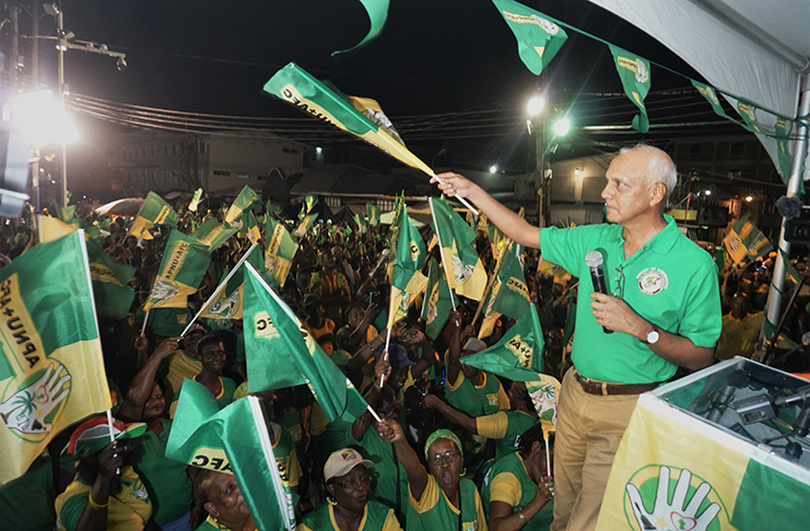 Minister of Communities, Ronald Bulkan celebrating with APNU+AFC supporters (Elvin Croker photo)