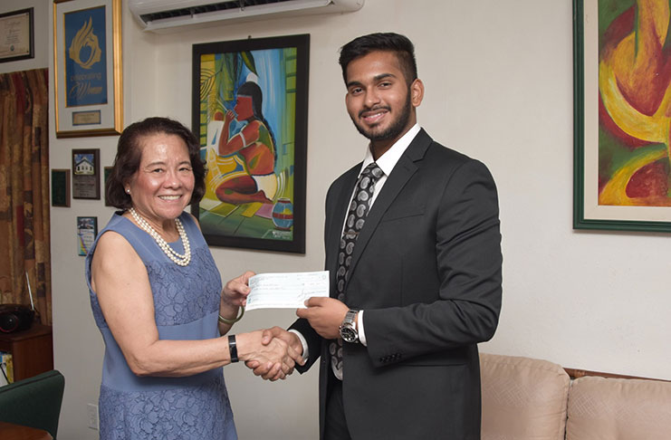 First Lady, Mrs. Sandra Granger collects a cheque from GAICO’s Business Development Director, Mr. Khishan Singh. The monetary donation will go towards the work being done by the Anira Foundation
