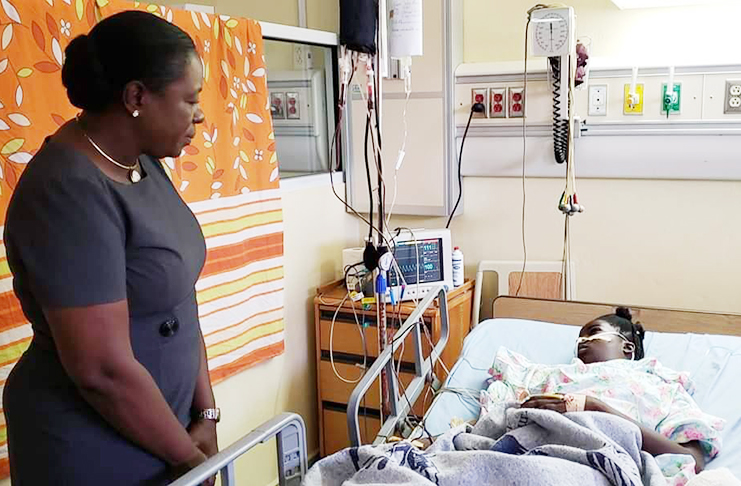 Minister Nicolette Henry visits the critical LFSS student at the Linden Hospital Complex